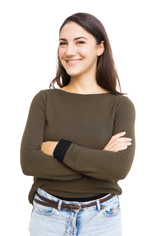 Woman smiling with arms crossed, wearing a green long-sleeved shirt and blue jeans.