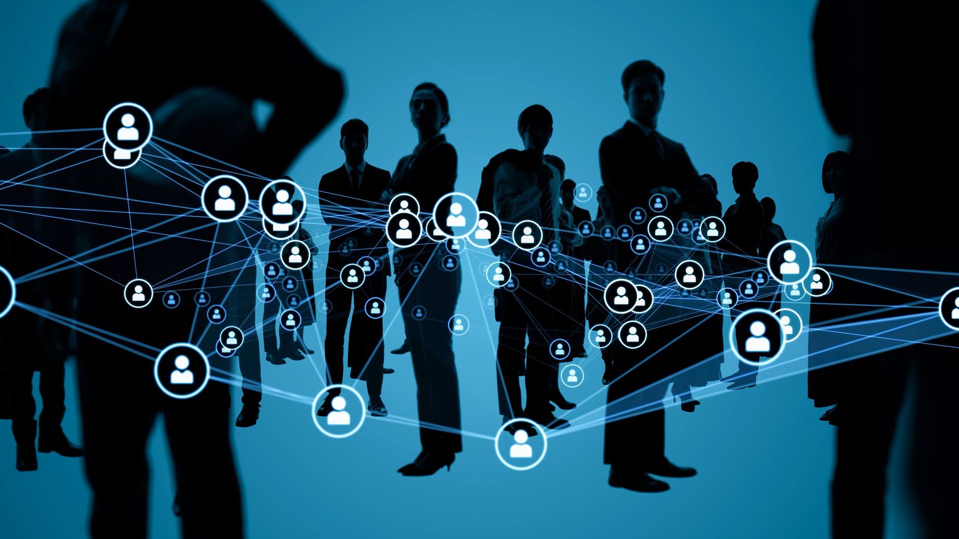 A group of people are standing next to each other on a blue background.