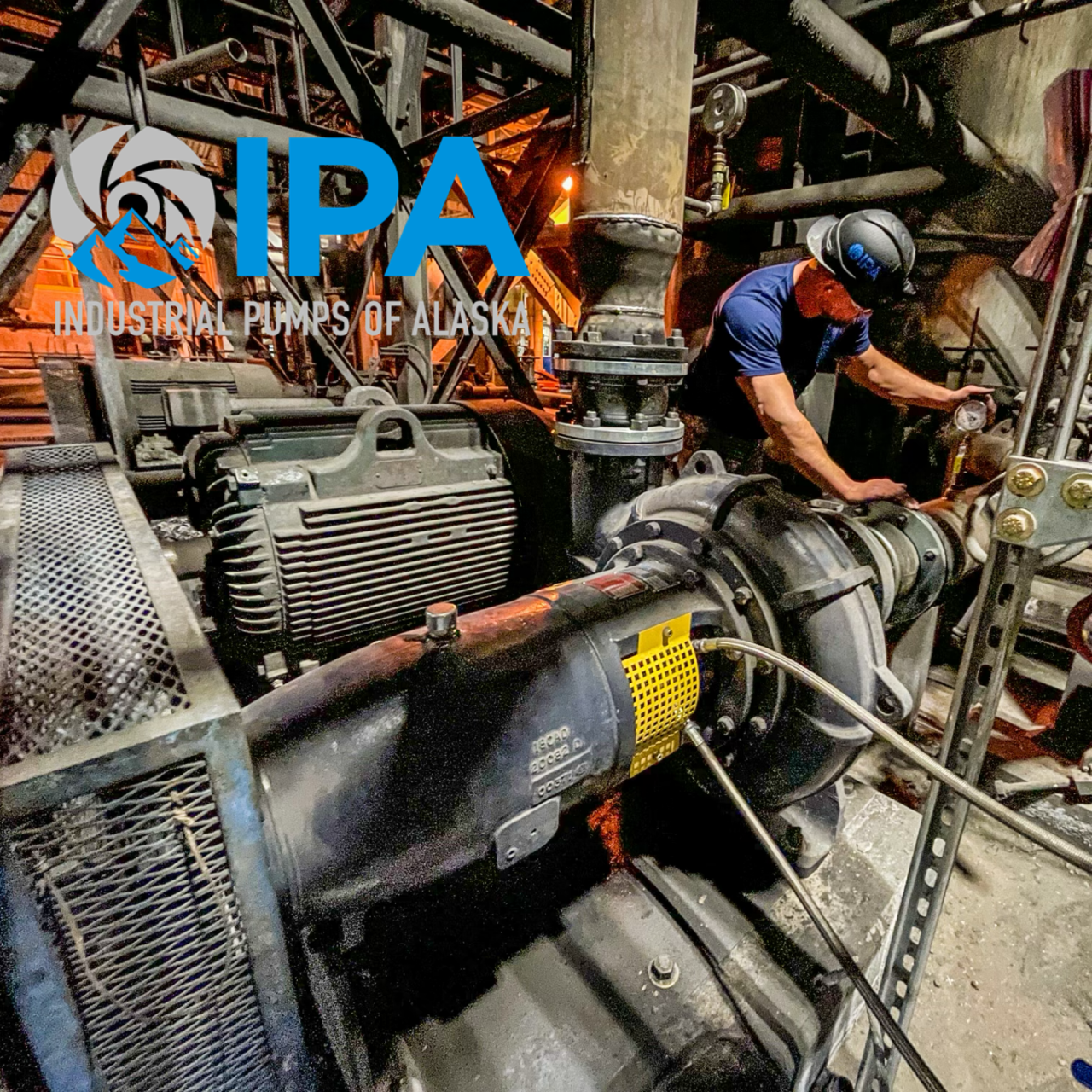A man is working on an industrial pump in alaska