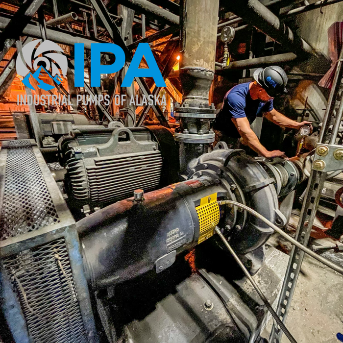 A man is working on an industrial pump in alaska