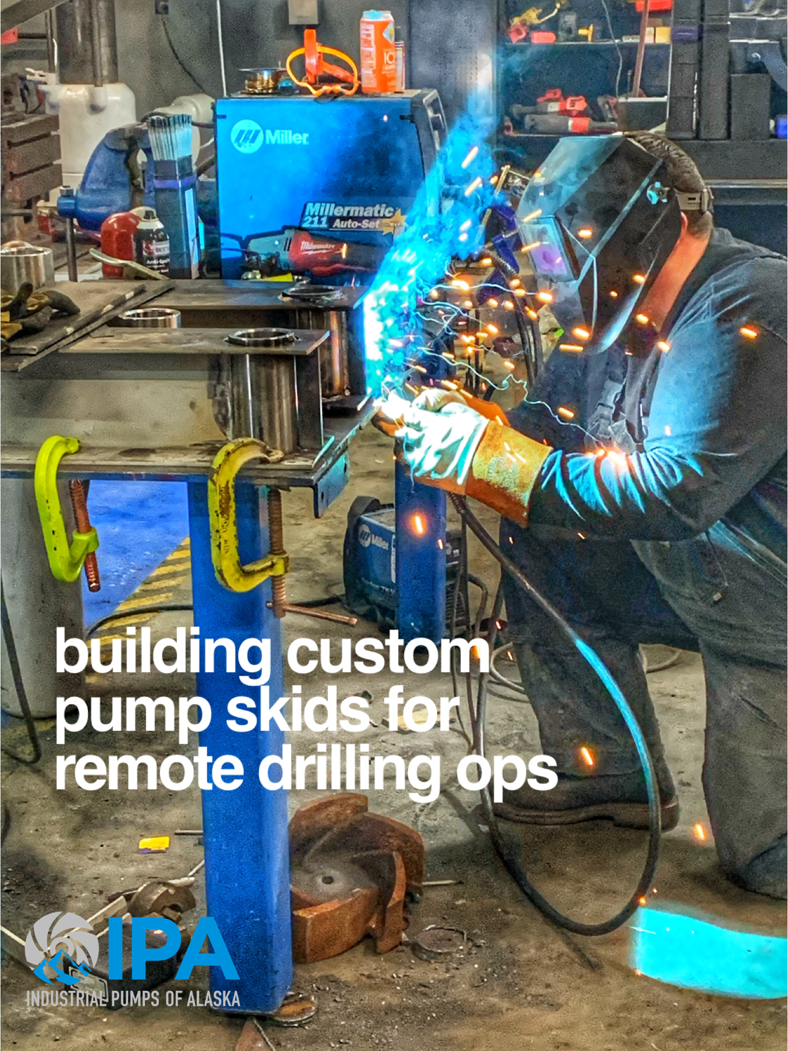 A man is welding a piece of metal in a factory.