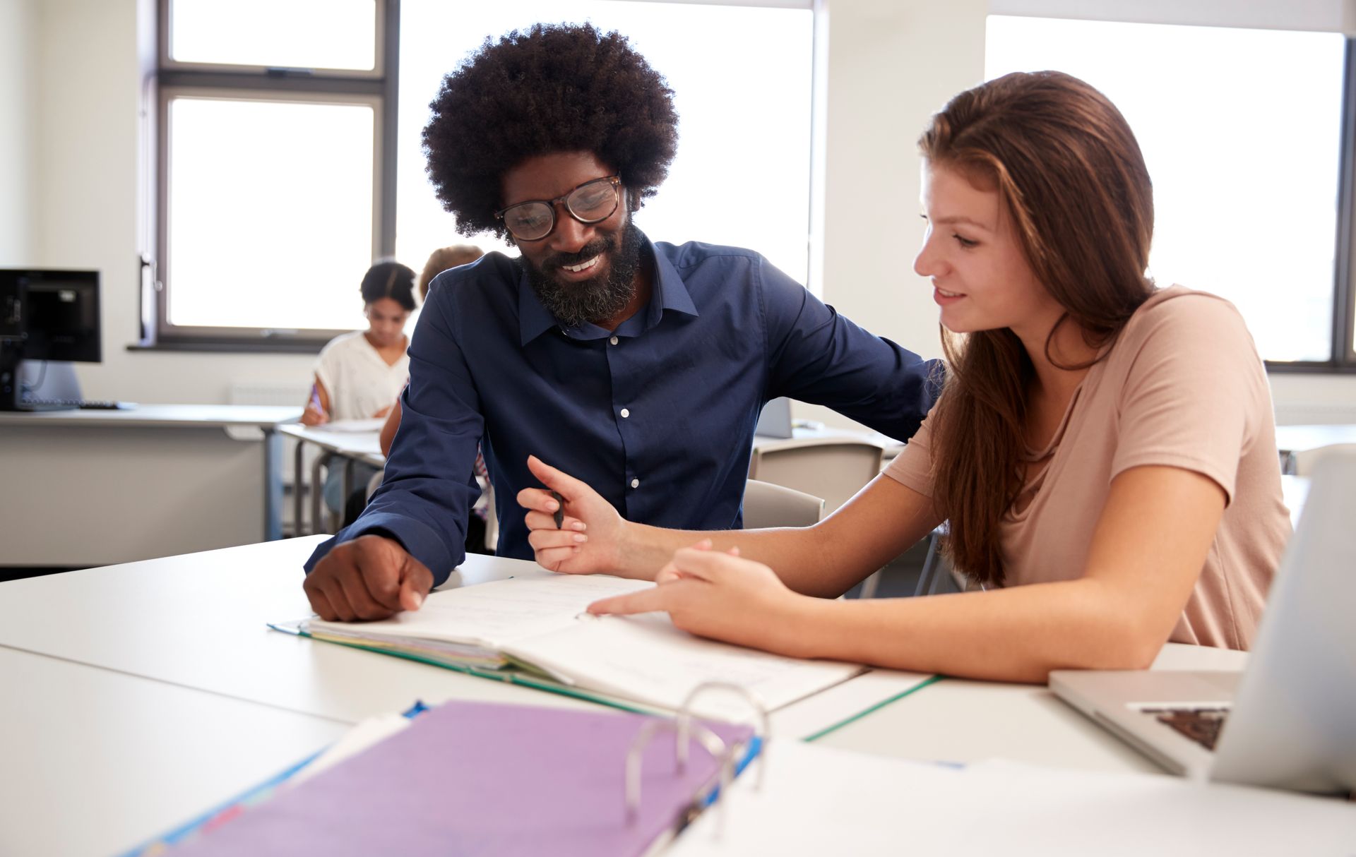 Instructor With Notebook Psychological Therapy Services | Luminous Minds Therapy