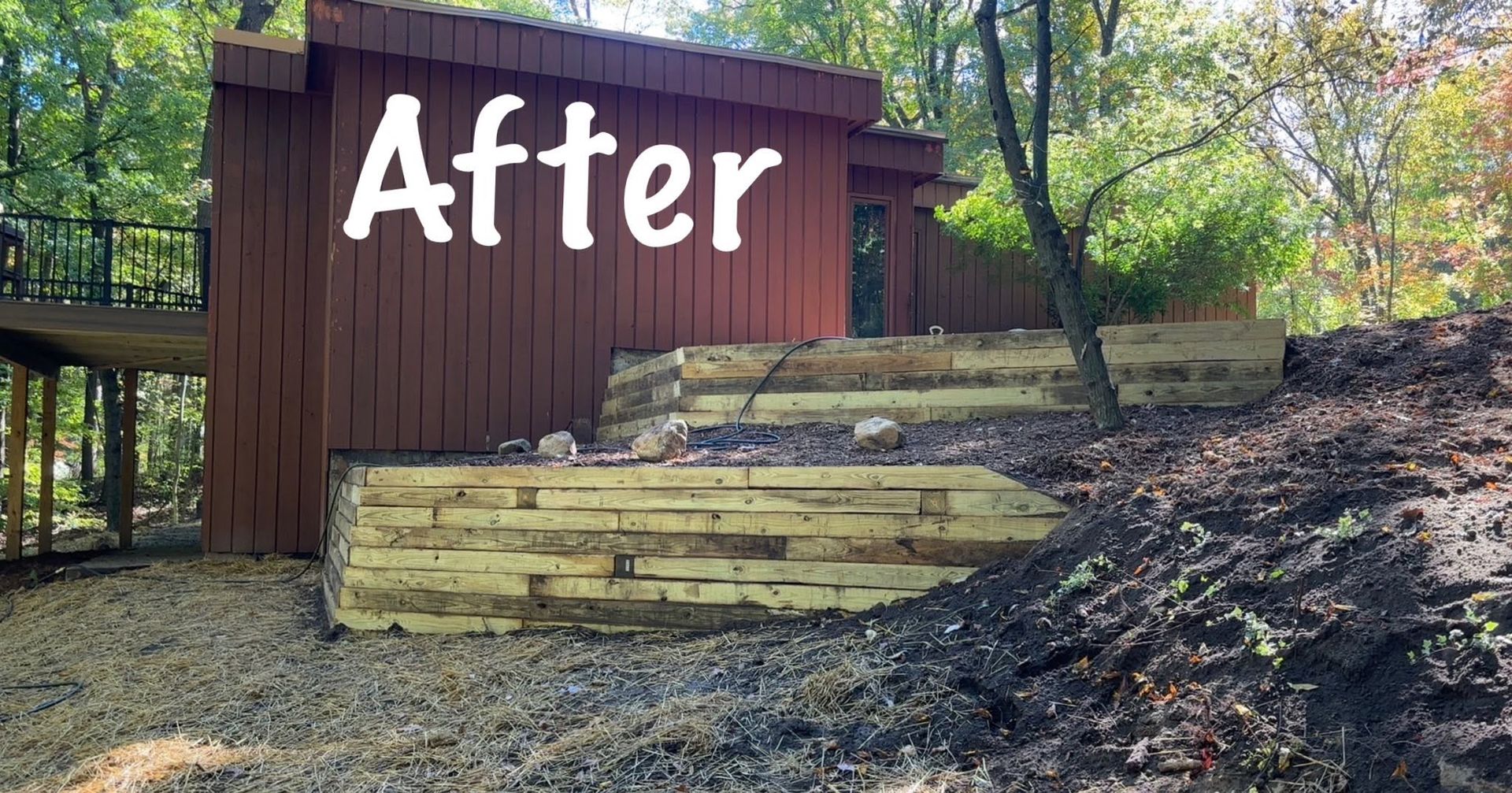Wooden steps and retaining wall beside a brown shed on a wooded hillside, labeled “After”