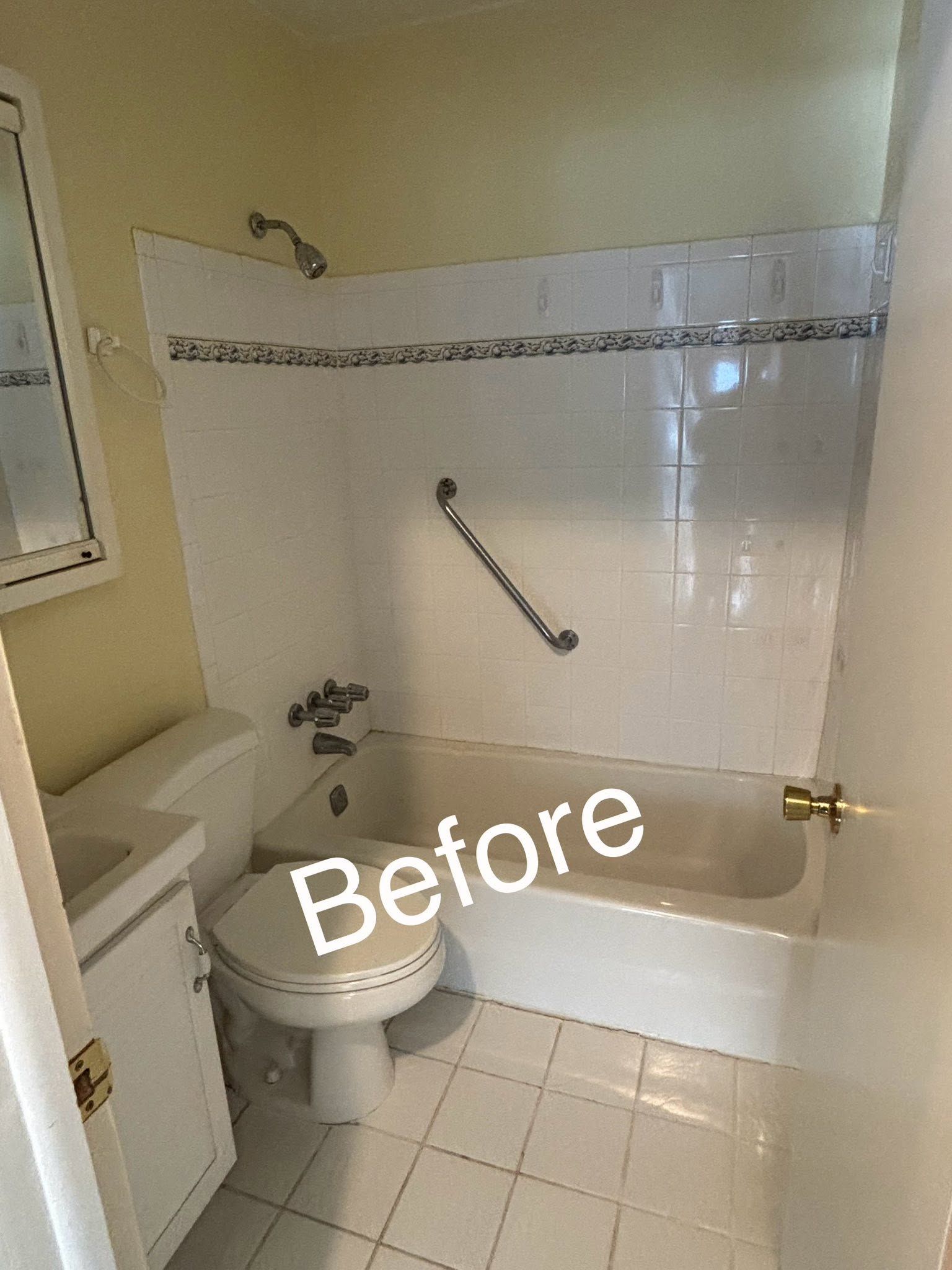 Small beige bathroom with toilet, bathtub, grab bar, and tiled floor, labeled “Before”
