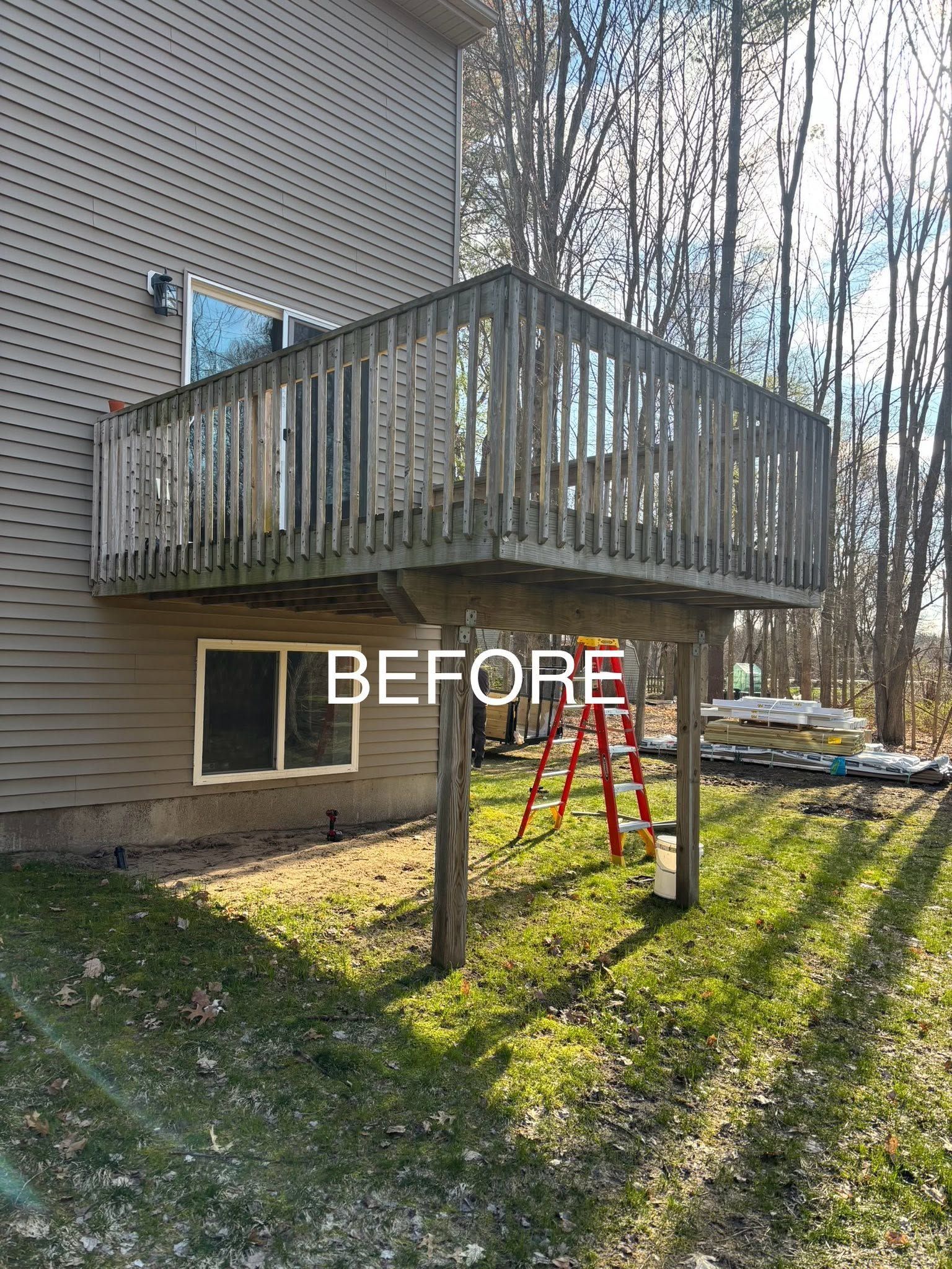 Backyard deck attached to house with a ladder underneath and “BEFORE” text overlay
