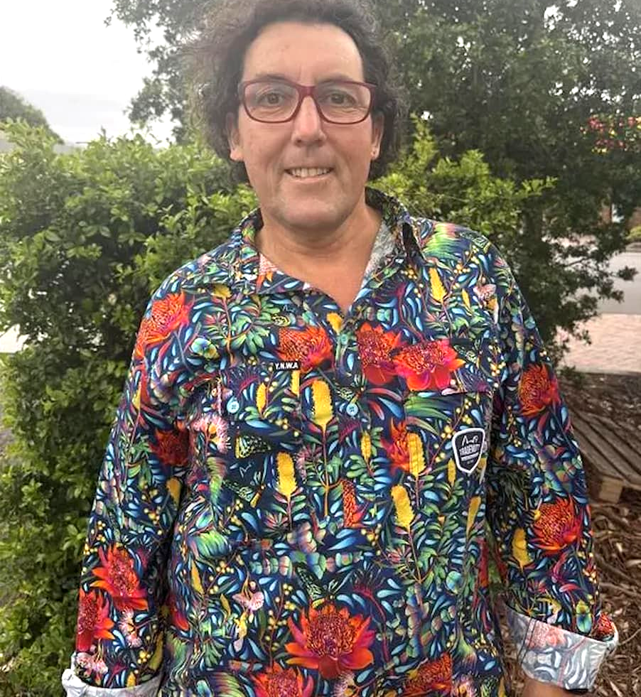 Person Wearing a Colourful Floral Shirt and Glasses, Smiling Outdoors in Front of Trees — Catios By Paulie in Blackbutt, NSW