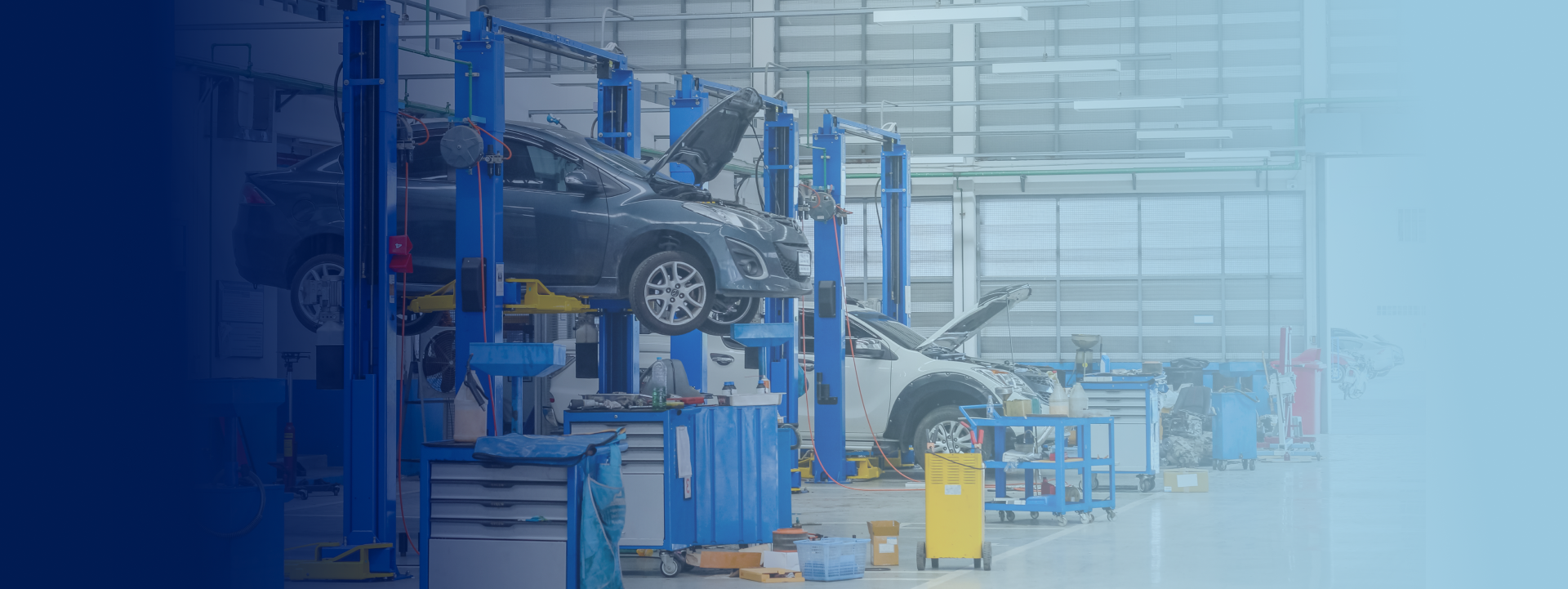Garage with car lifted up for reliable auto repair in Bloomingdale, GA | Elton's Auto