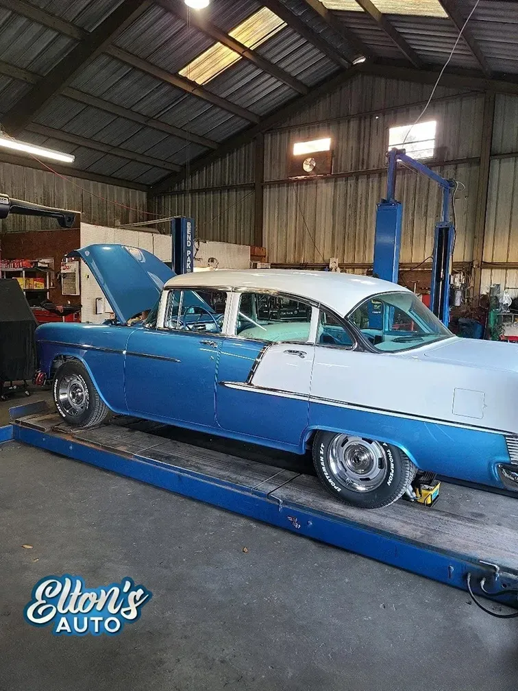 White and blue classic car inside of our garage in Bloomingdale, GA | Elton's Auto