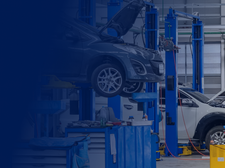 Garage with car lifted up for reliable auto repair in Bloomingdale, GA | Elton's Auto