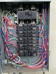 A bunch of wires are plugged into a power strip