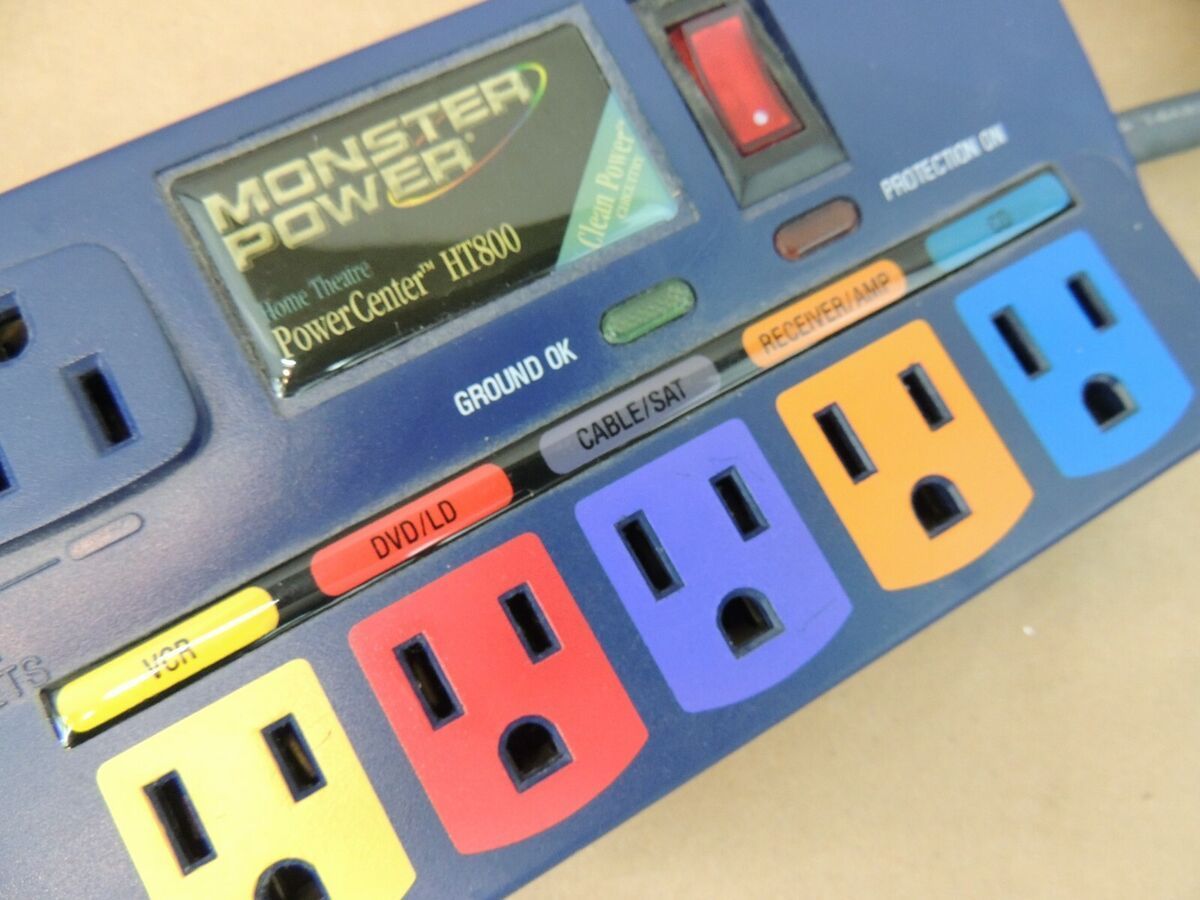 A blue monster power strip with colored outlets