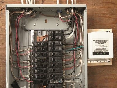 A electrical box with a lot of wires coming out of it.