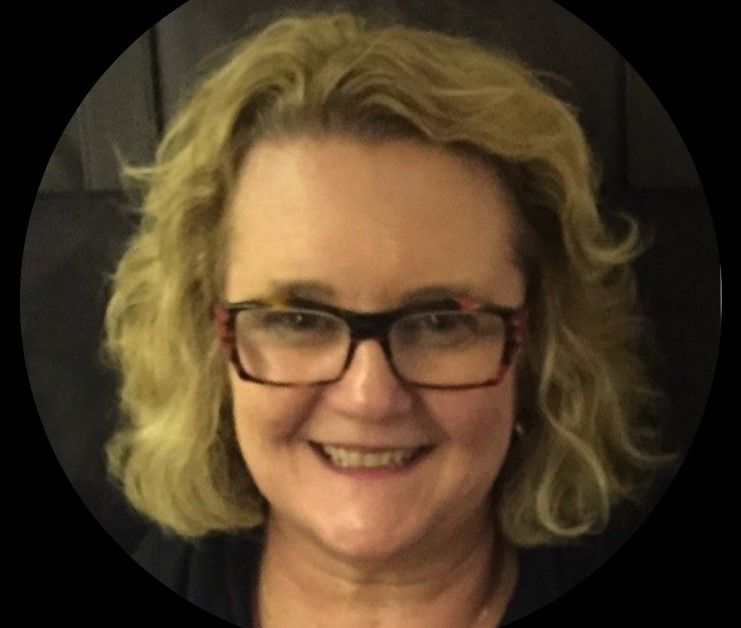 A woman wearing glasses is smiling in a circle.