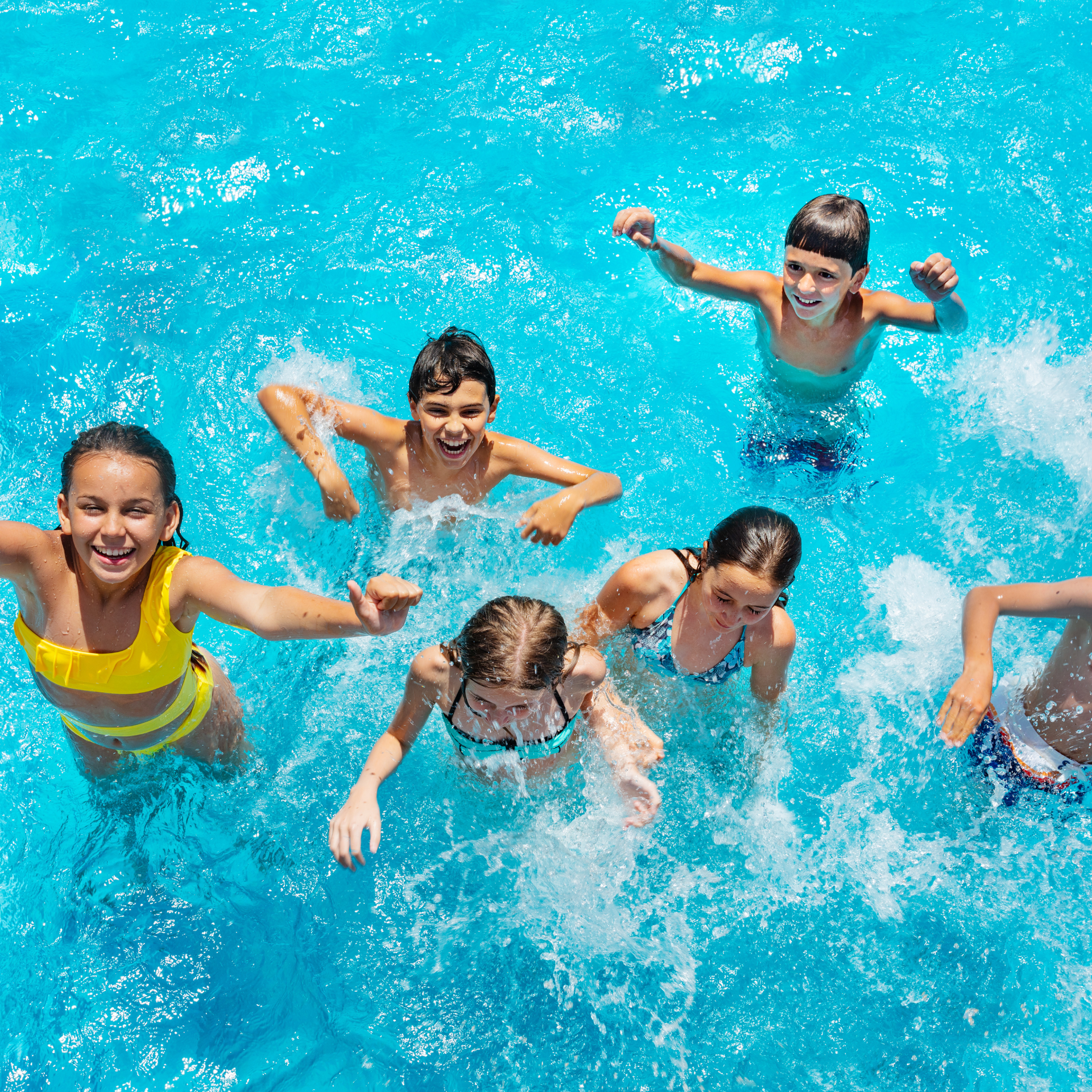 Kids swimming in a clean, well-maintained pool serviced by Southern Sun Pool Service