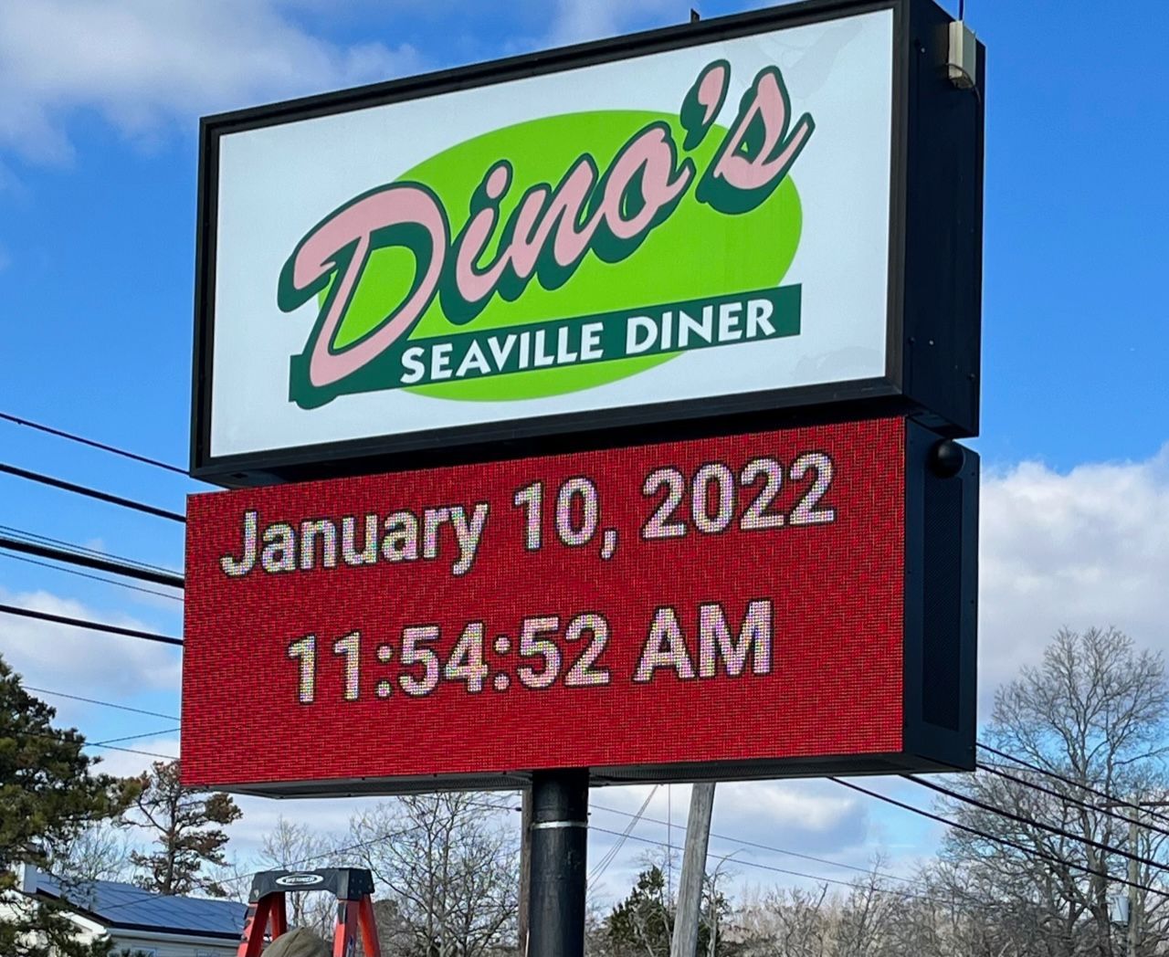 Dino's Seaville Diner sign with the date January 10, 2022, and time 11:54:52 AM on a red panel.