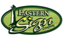 Eastern Sign Company logo: green oval frame, lighthouse, text 