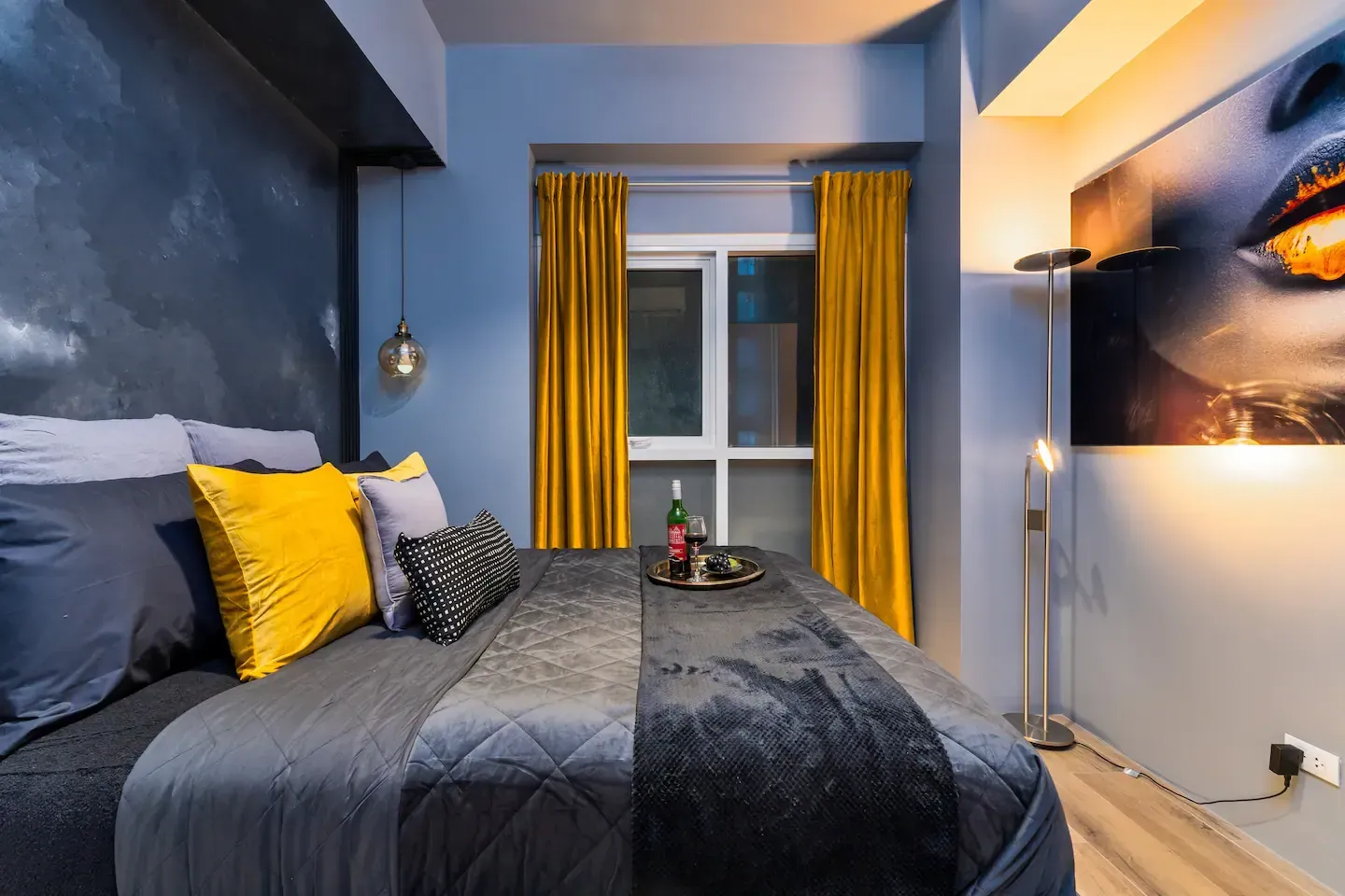A bedroom with a bed , curtains and a window.   The Den at Bayshore Luxe by Prime, Manila