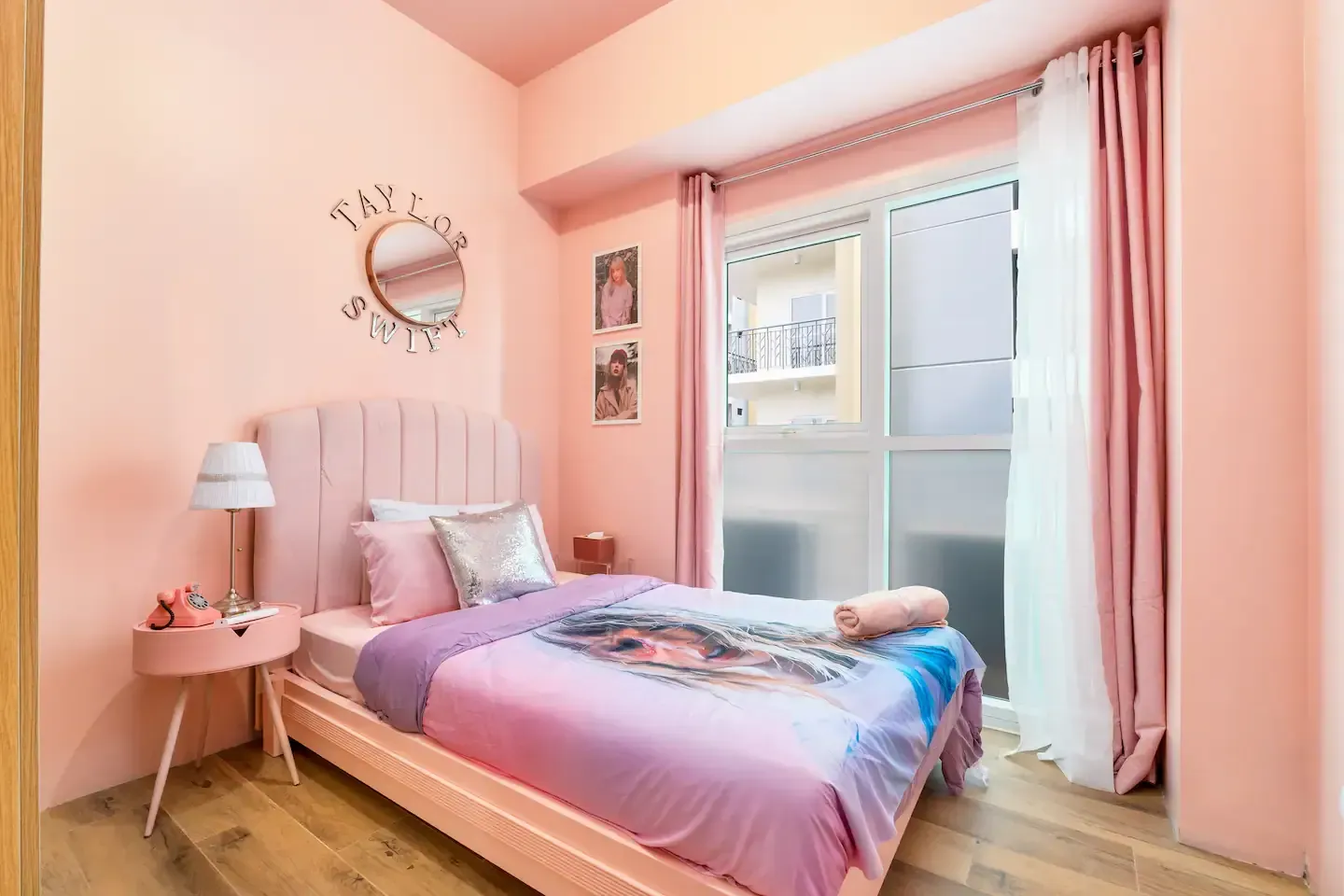 A bedroom with pink walls and a pink bed at Bayshore Luxe by Prime, Manila