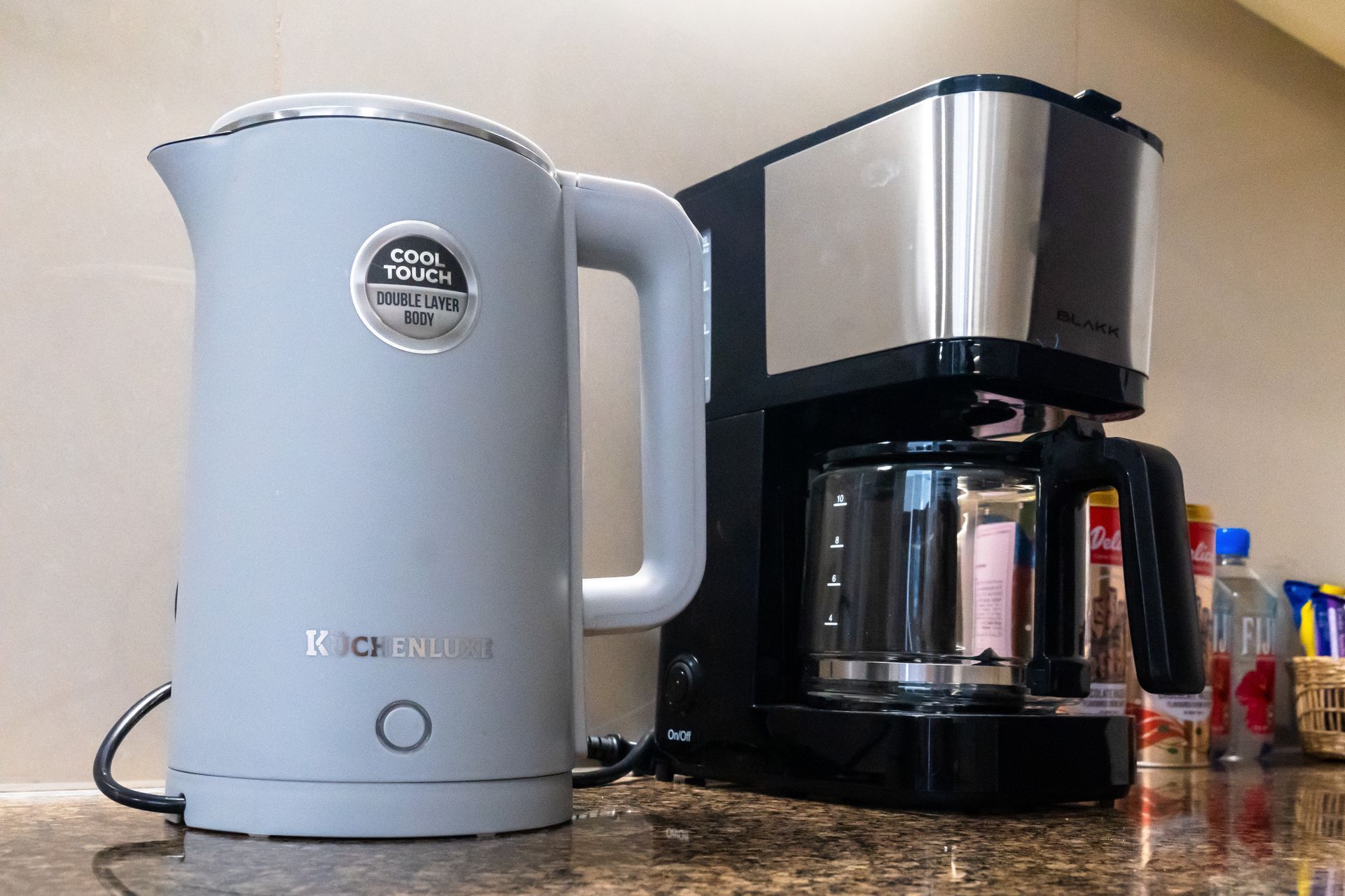 Kettle and coffee machine on a kitchen countertop