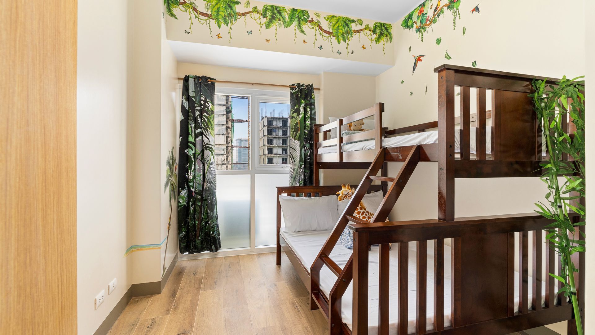 Double Deck bunk bed with white linens and tropical decal 
