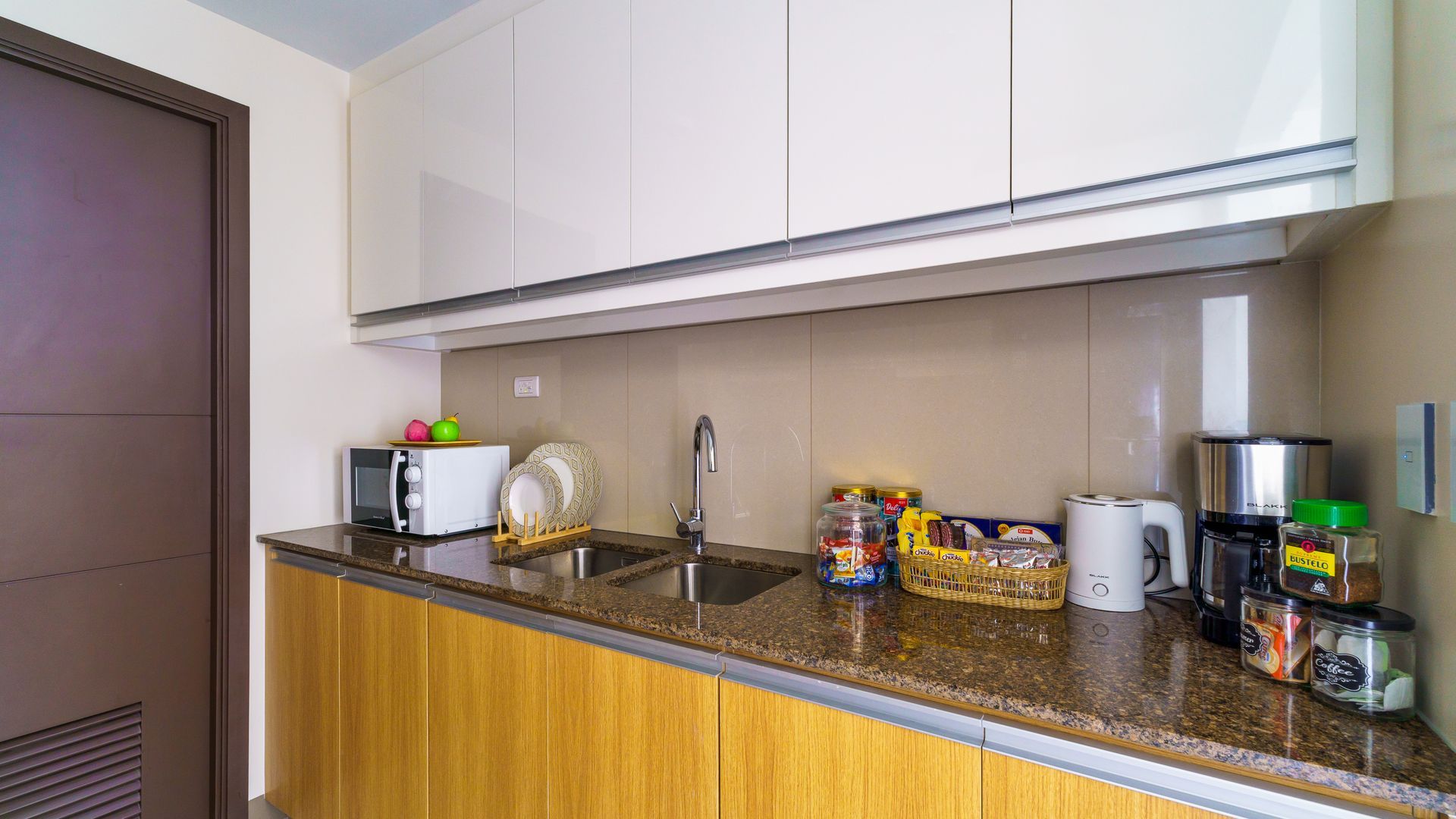 Kitchen cupboards with a counter top and sink 