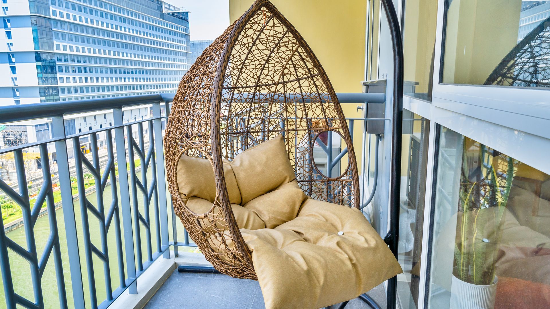 Suspended bucket chair on a balcony