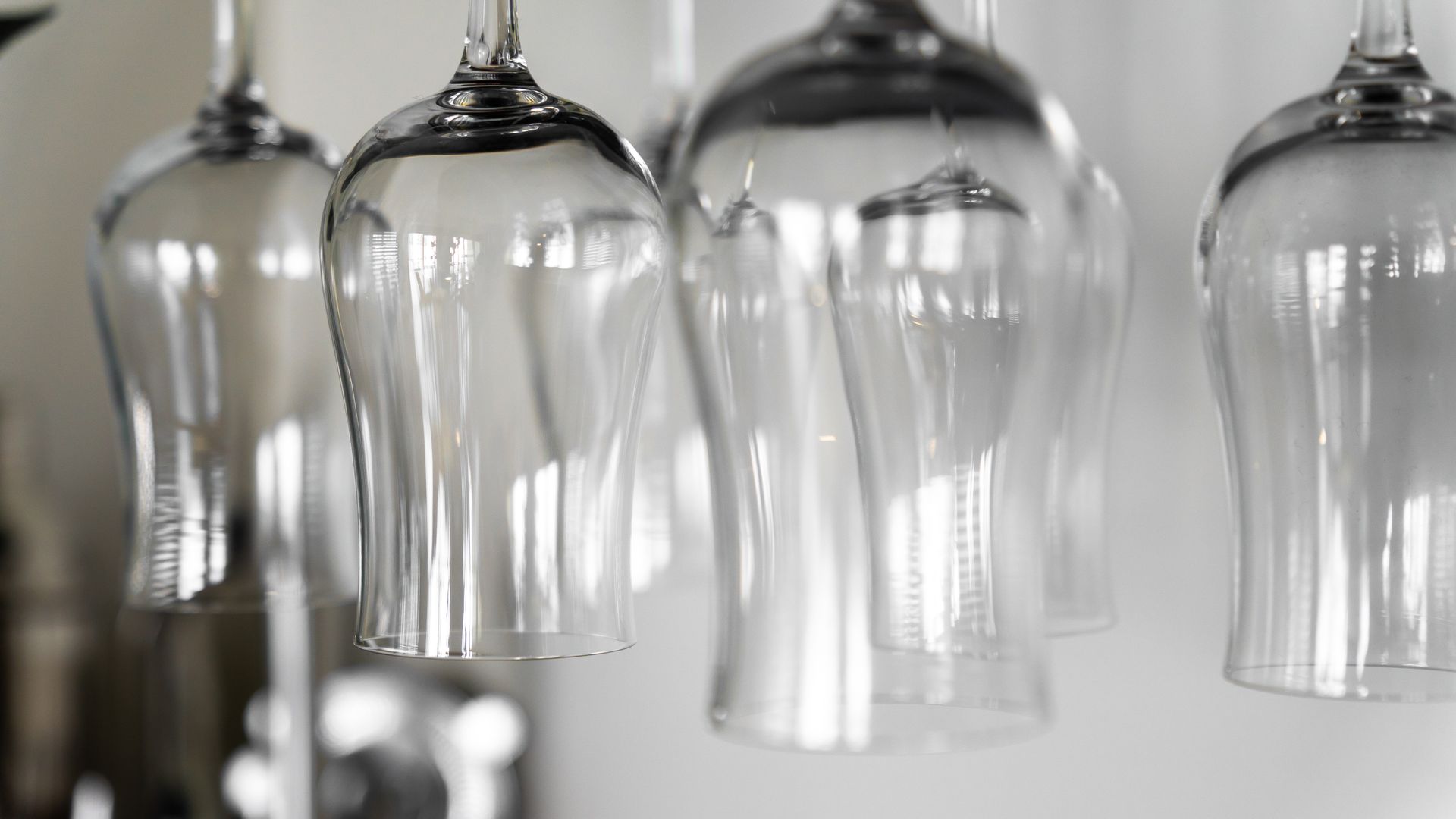 Cocktail glasses hanging upside down 