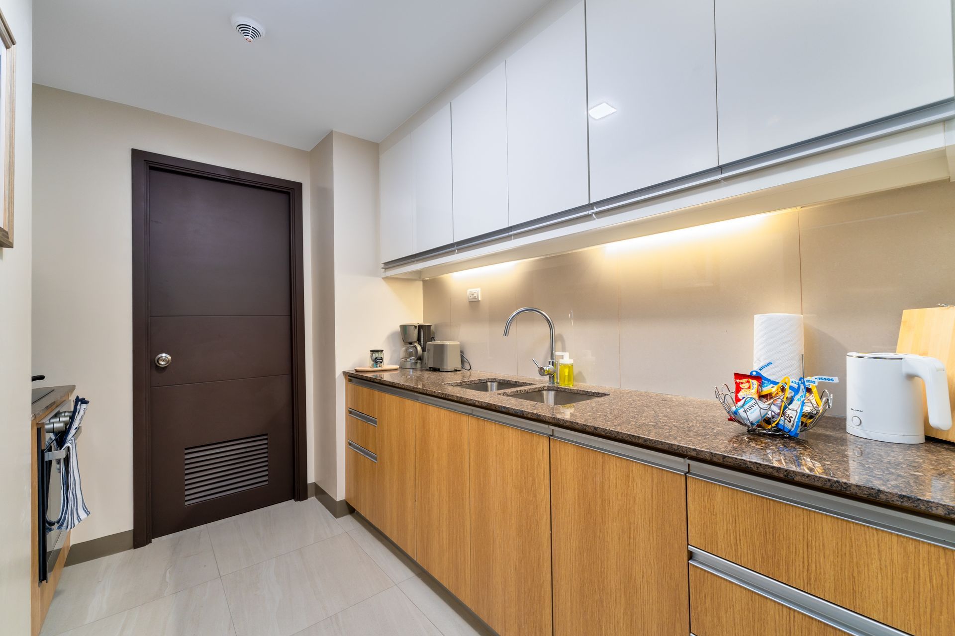 Kitchen counter with sink, toaster and coffee maker
