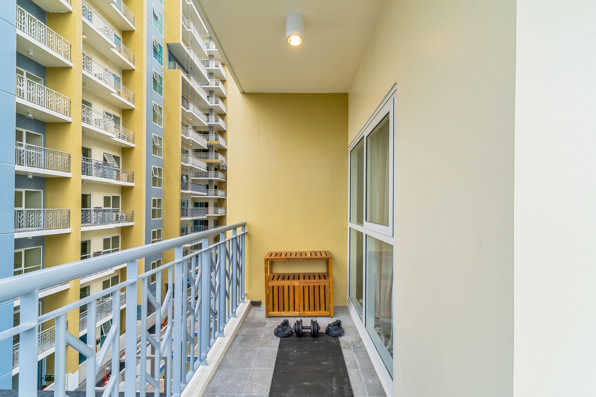 There is a balcony in the middle of a building.