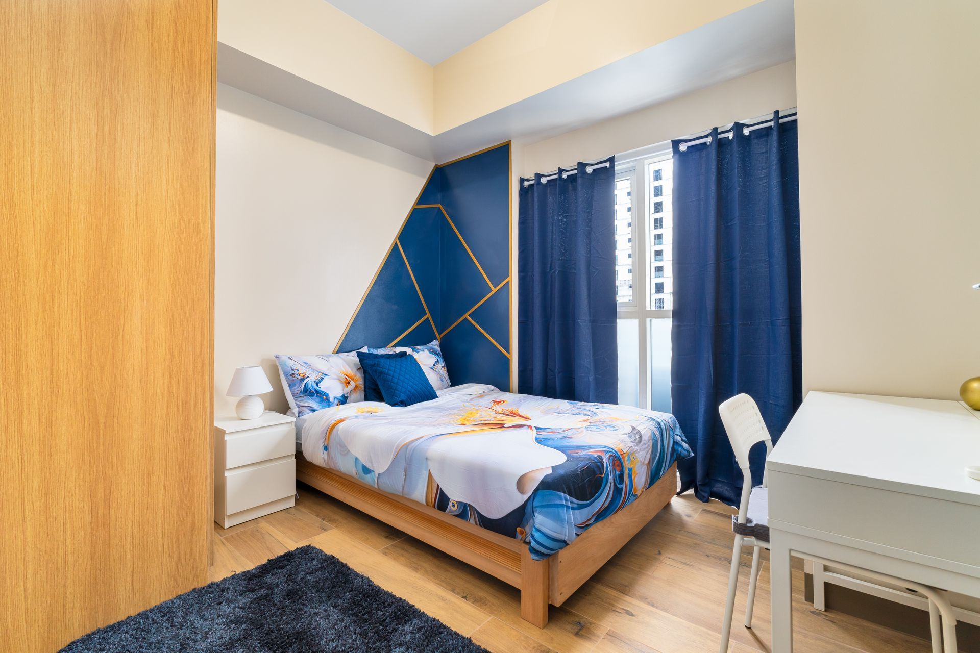 Bedroom decorated in nautical blues and white