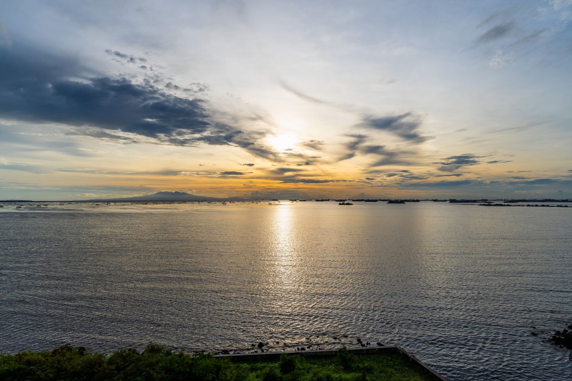The sun is setting over Manila Bay, Captains Quarters at Bayshore Luxe by Prime, Manila