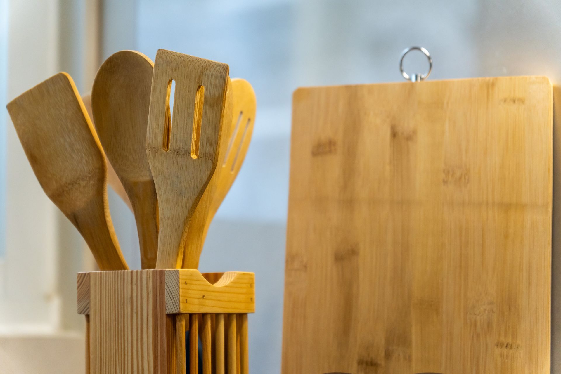 wooden cooking utensils and cutting board