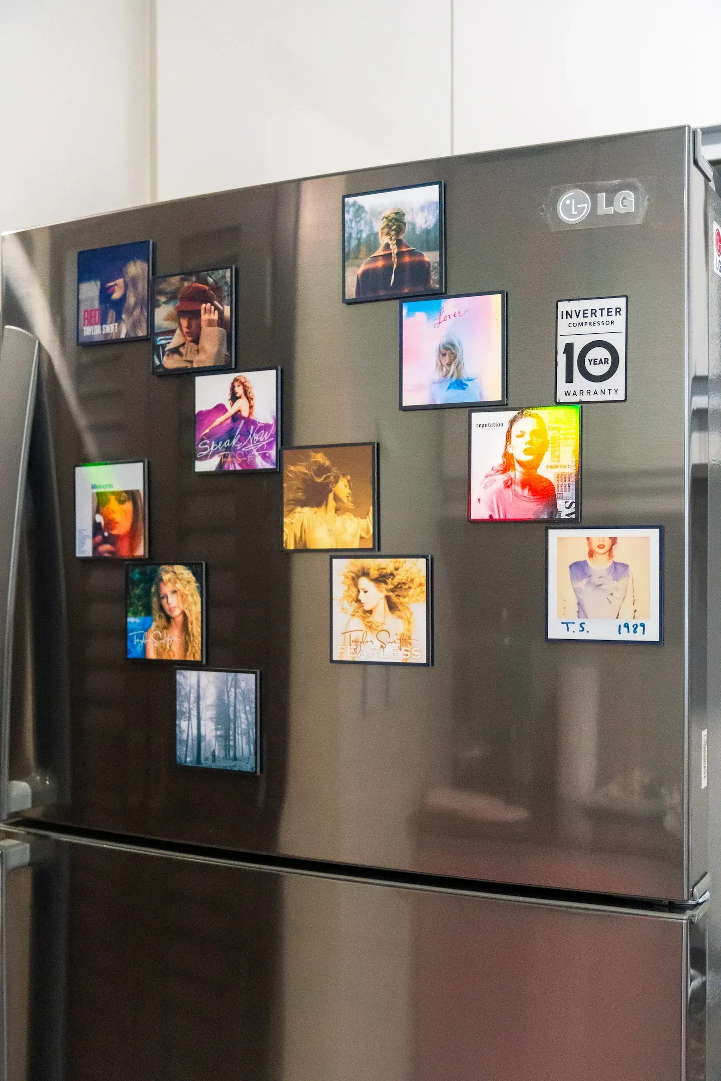 An lg refrigerator with a lot of Taylor Swift magnets on it at Bayshore Luxe by Prime, Manila