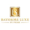 The logo for bayshore luxe by prime has a gold letter b in a square.