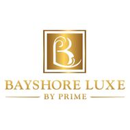 The logo for bayshore luxe by prime has a gold letter b in a square.