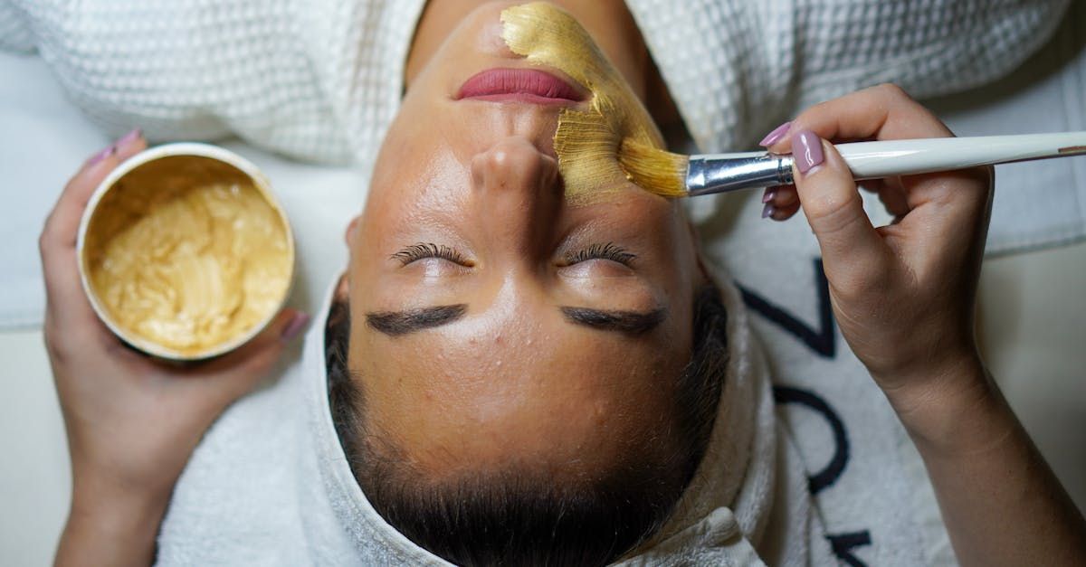 A woman is getting a facial treatment at a spa.