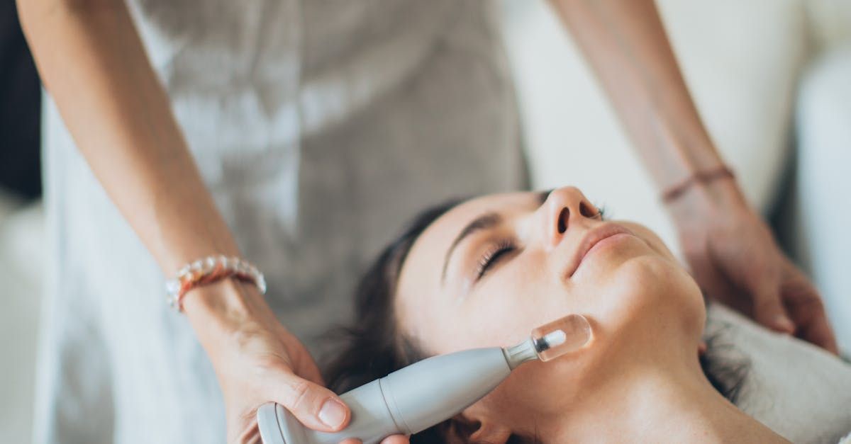 A woman is getting a facial treatment at a beauty salon.