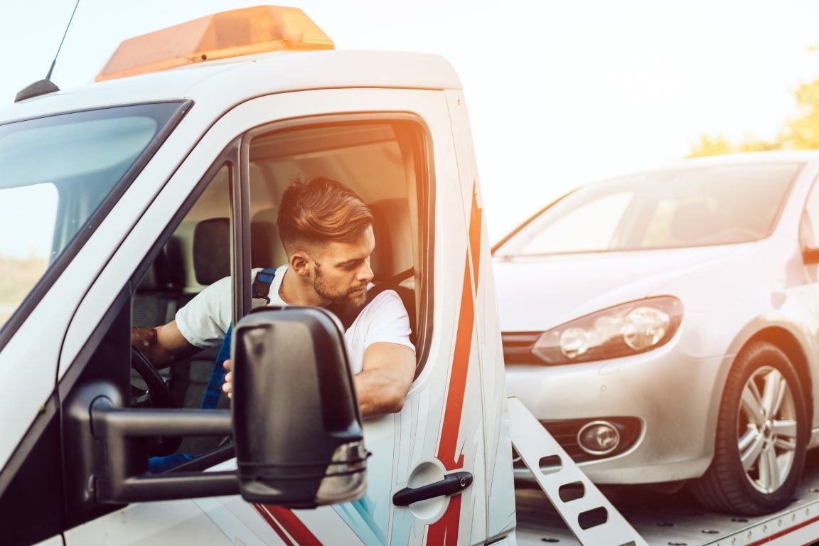Tow Truck Driver towing a vehicle