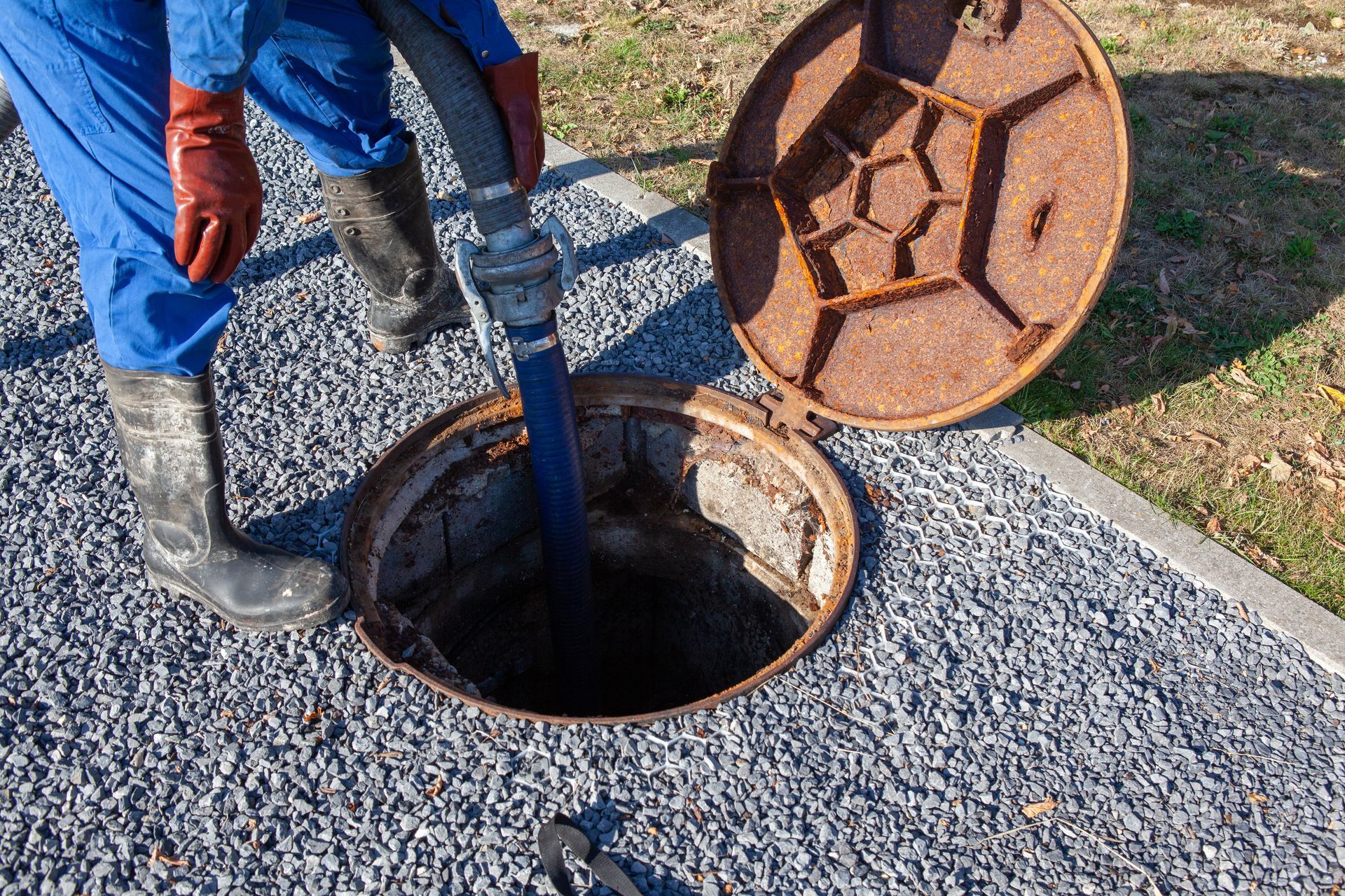 Water Well Service Contractor inspecting a residential well pump and pressure tank
