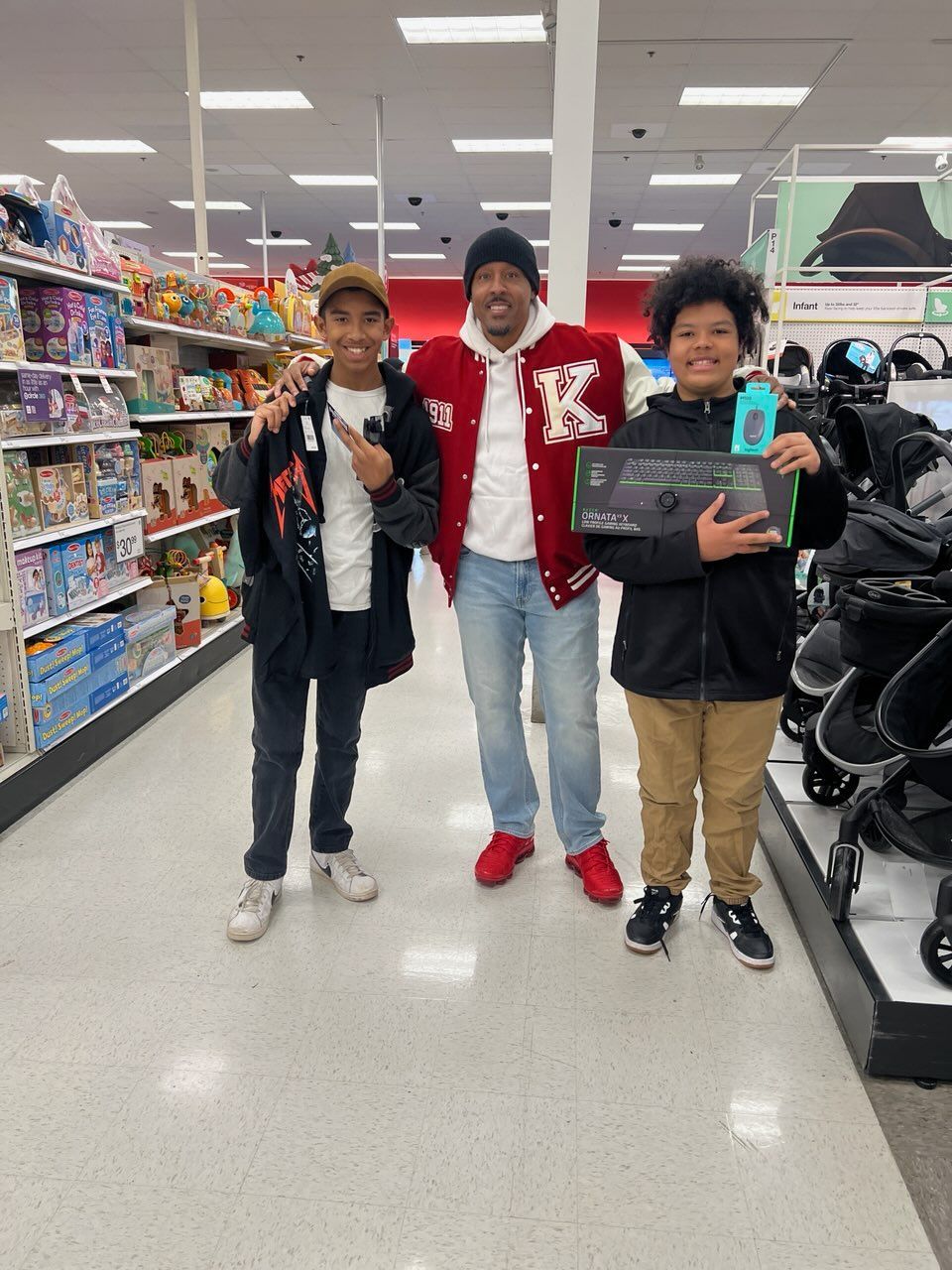 Children shopping with Kappa members during a Shop with a Kappa holiday event