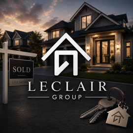 LeClair Group logo with gold text and gray house icon over a dark city skyline.