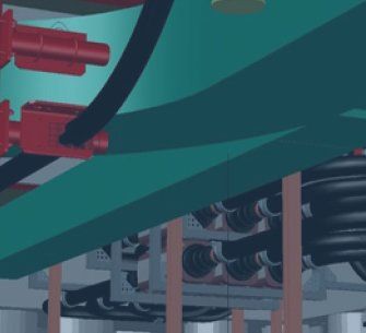 Red mechanical parts and black cables attached to a teal structure.