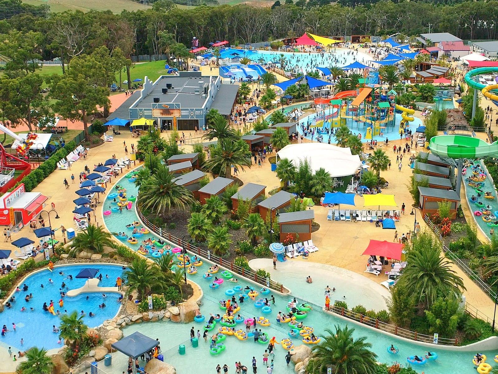 Overhead image of Gumbuya world, featuring prominent water park activities and plentiful palm trees