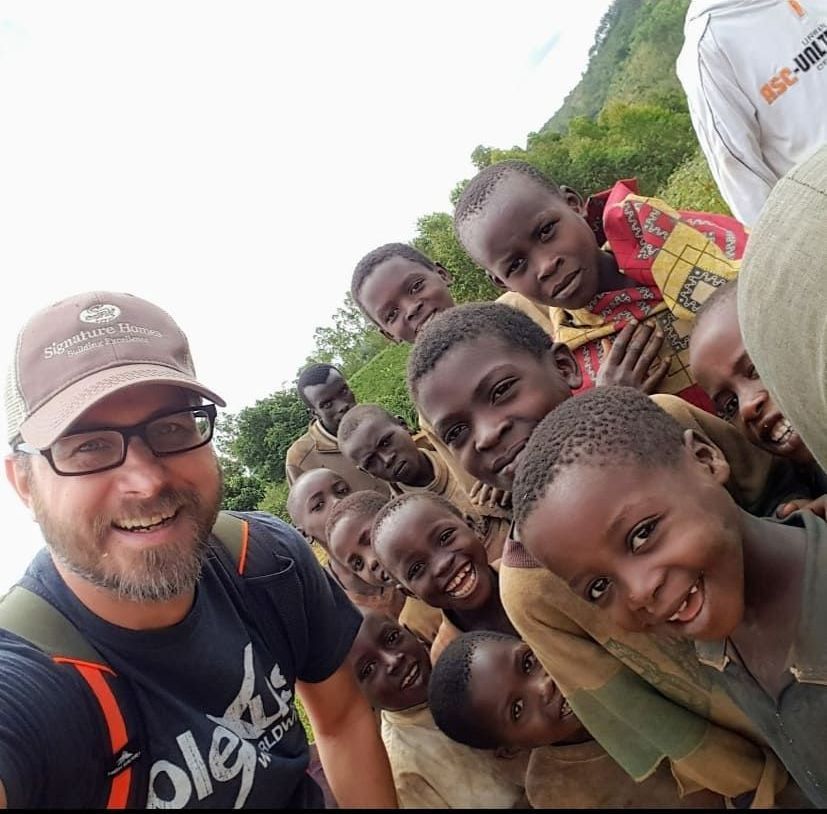 A Selfie With a Man & Many Kids. Learn About Three Story Coffee's Partnership With Long Miles.