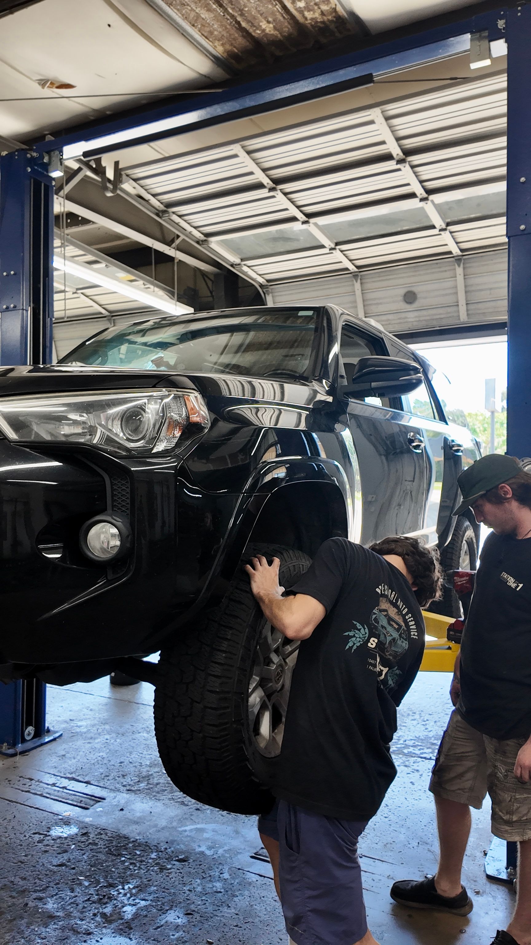 Our Certified Mechanics are Working on a Wheel at Station One