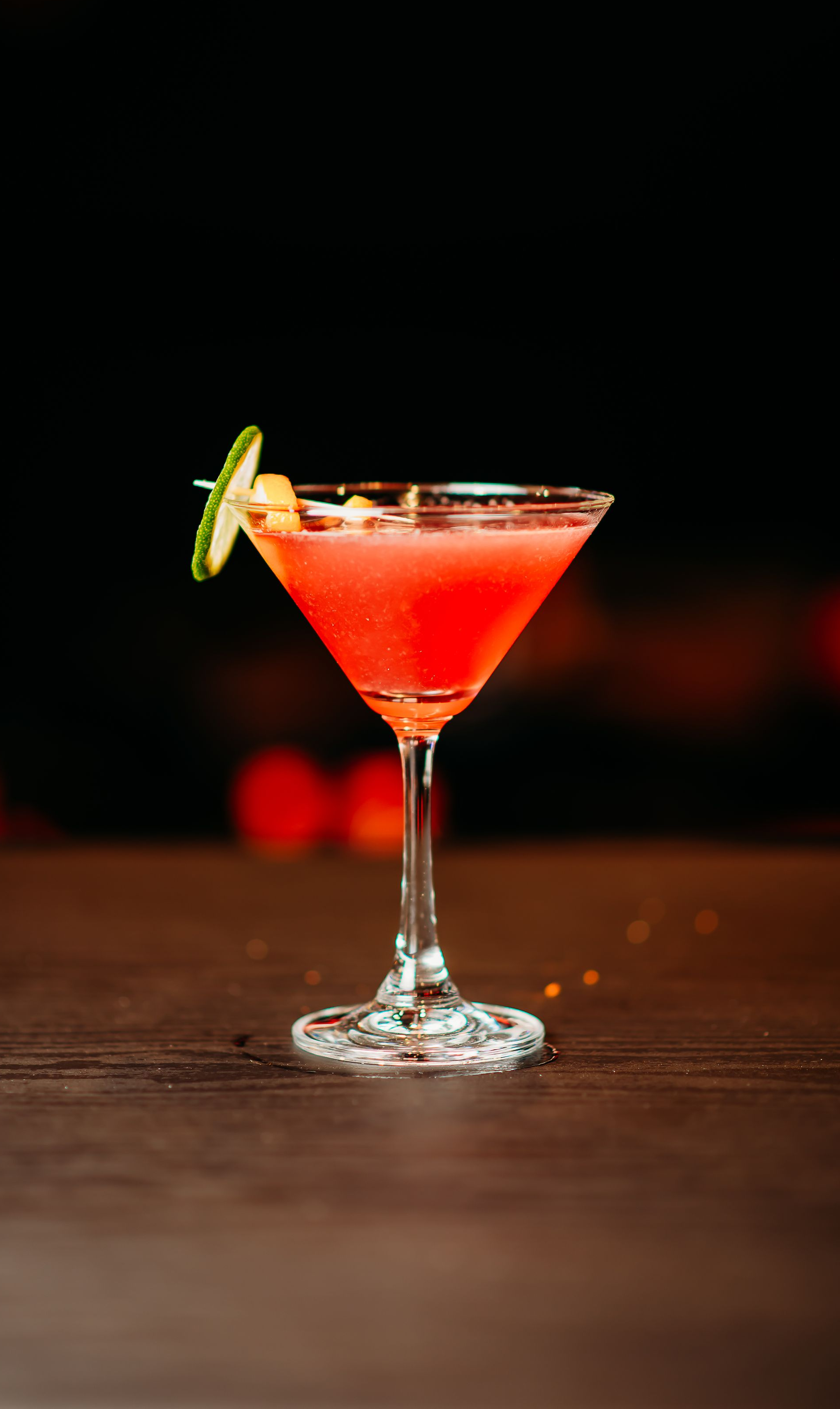 A row of different alcoholic beverages on a black background