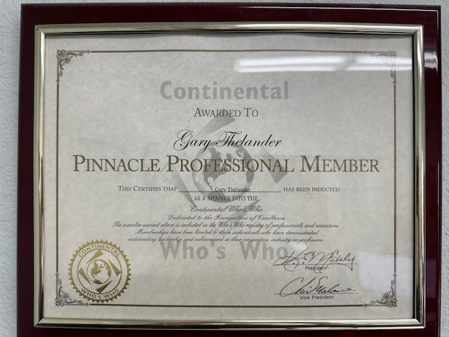 Certificate framed in a dark wood. Awarded to Gary Thelander, Pinnacle Professional Member, by Continental & Who's Who.