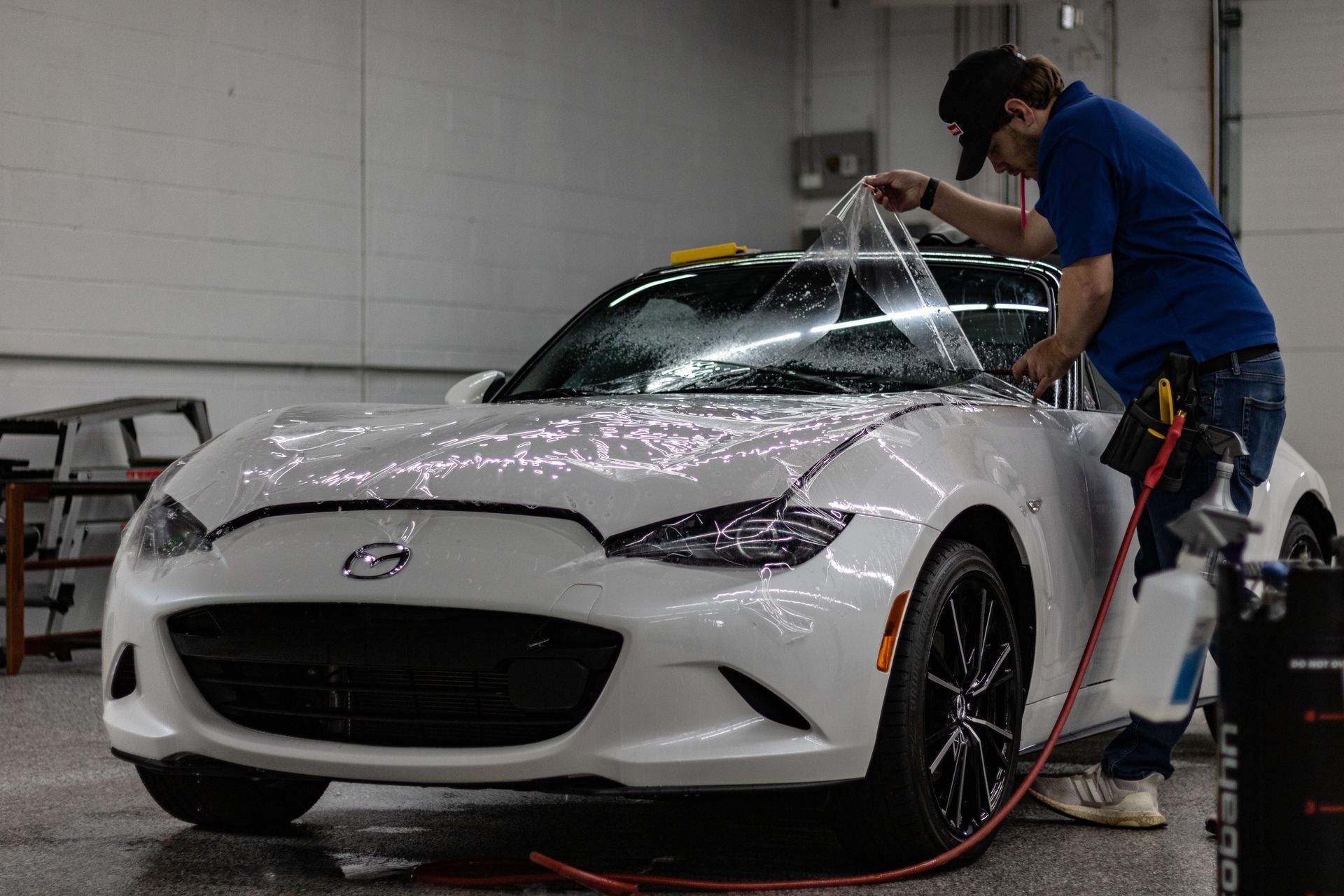 Professional applying paint protection film