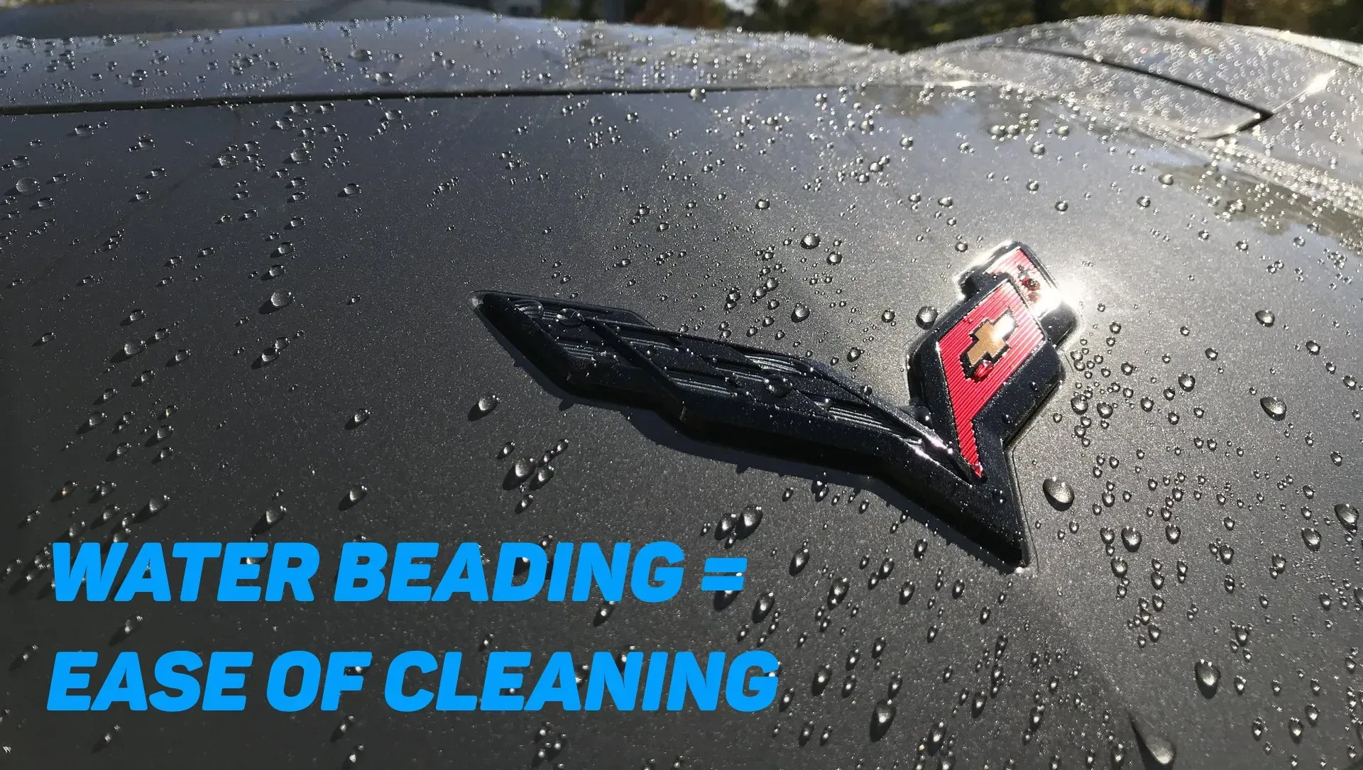 A black car with water drops on it and the words water beading ease of cleaning