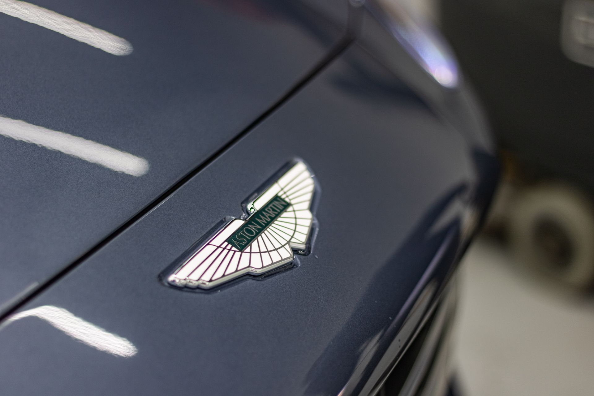 A close up of the hood of an aston martin car